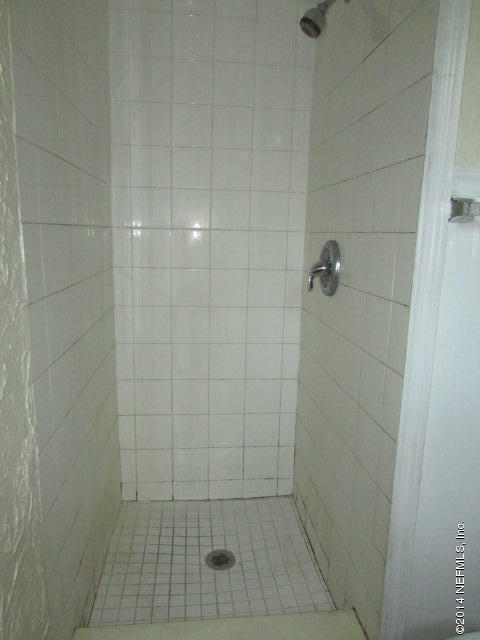 3018 Kline Road Jacksonville, FL 32246 - Photo 17 of 23 a bathroom with a glass door shower