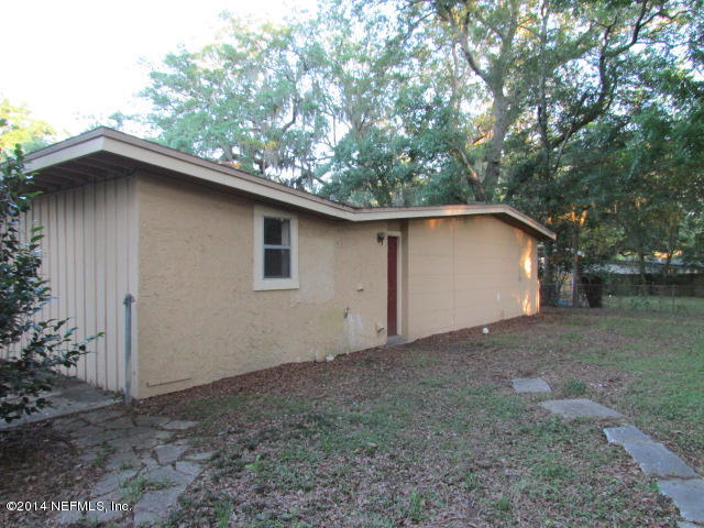 3018 Kline Road Jacksonville, FL 32246 - Photo 22 of 23 a backyard of a house with lots of green space