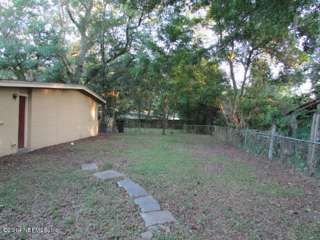 3018 Kline Road Jacksonville, FL 32246 - Photo 23 of 23 a backyard of a house with lots of green space