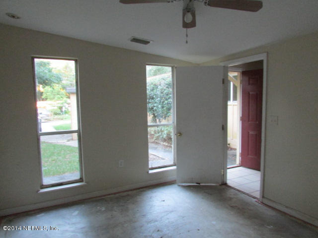 3018 Kline Road Jacksonville, FL 32246 - Photo 5 of 23 a view of an empty room with a window