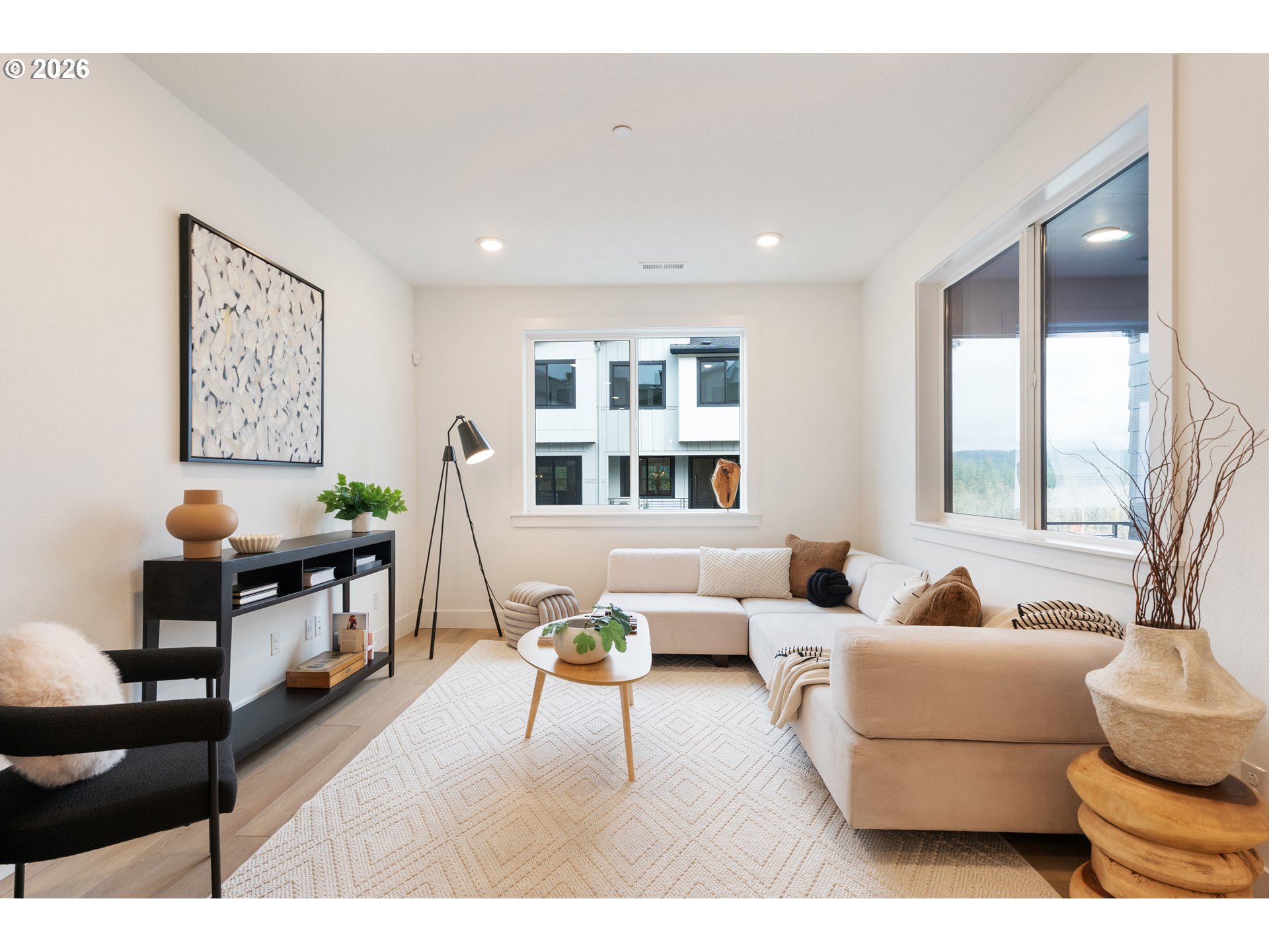6487 Northwest Olympic Lane, Unit 27 Camas, WA 98607 - Photo 12 of 24 a living room with furniture and wooden floor