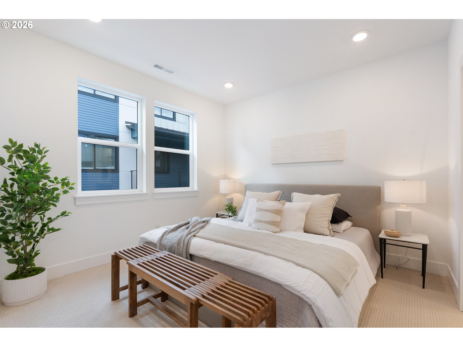 6487 Northwest Olympic Lane, Unit 27 Camas, WA 98607 - Photo 14 of 24 a bedroom with a bed and a potted plant