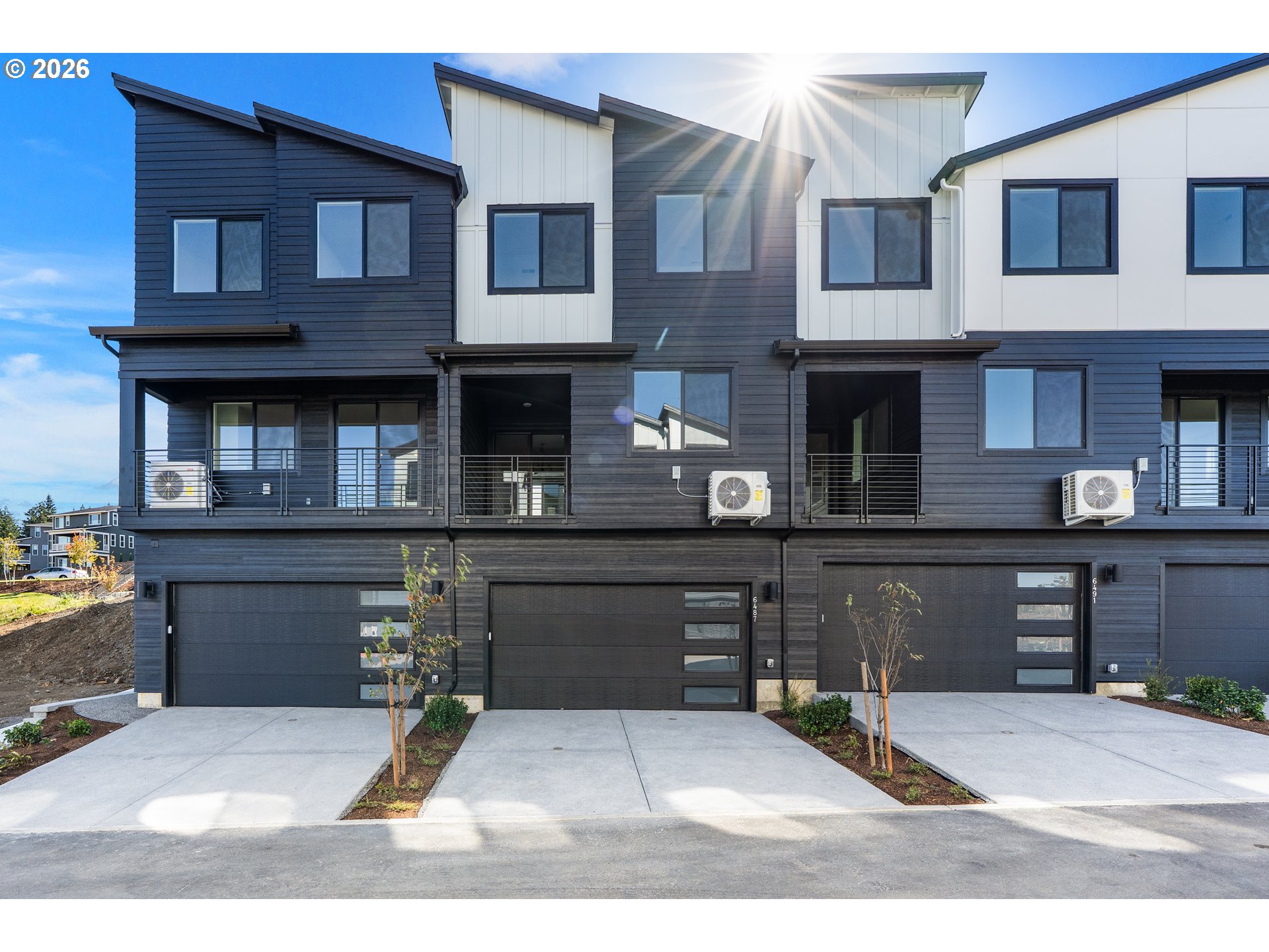 6487 Northwest Olympic Lane, Unit 27 Camas, WA 98607 - Photo 2 of 24 a black and white photo of a house