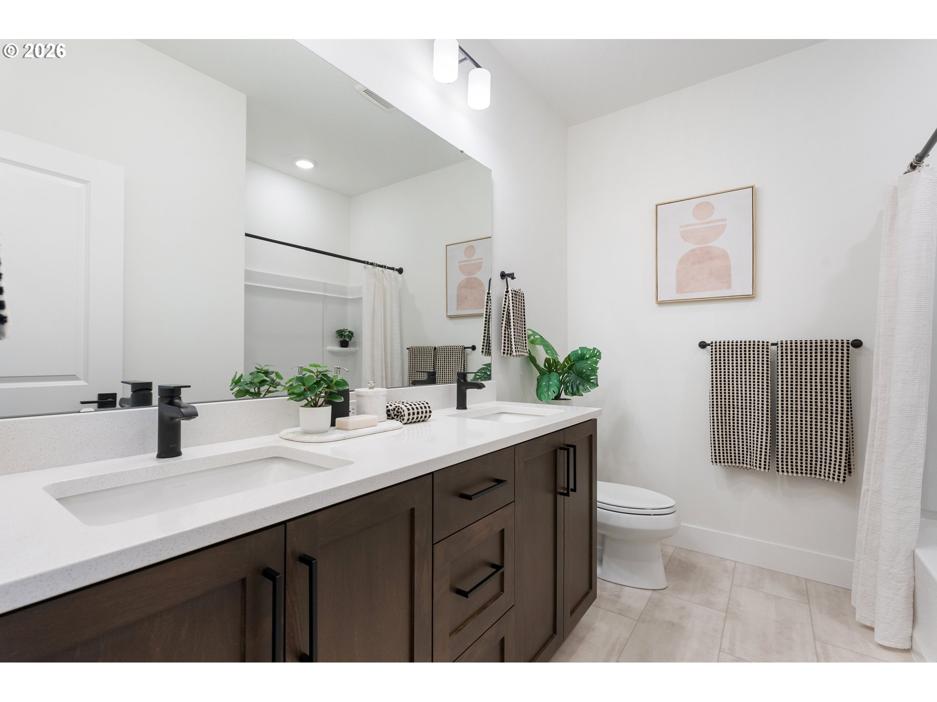 6487 Northwest Olympic Lane, Unit 27 Camas, WA 98607 - Photo 21 of 24 a bathroom with a sink double vanity and a mirror