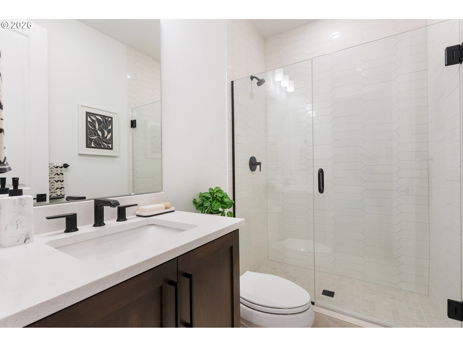 6487 Northwest Olympic Lane, Unit 27 Camas, WA 98607 - Photo 6 of 24 a bathroom with a sink shower and a mirror