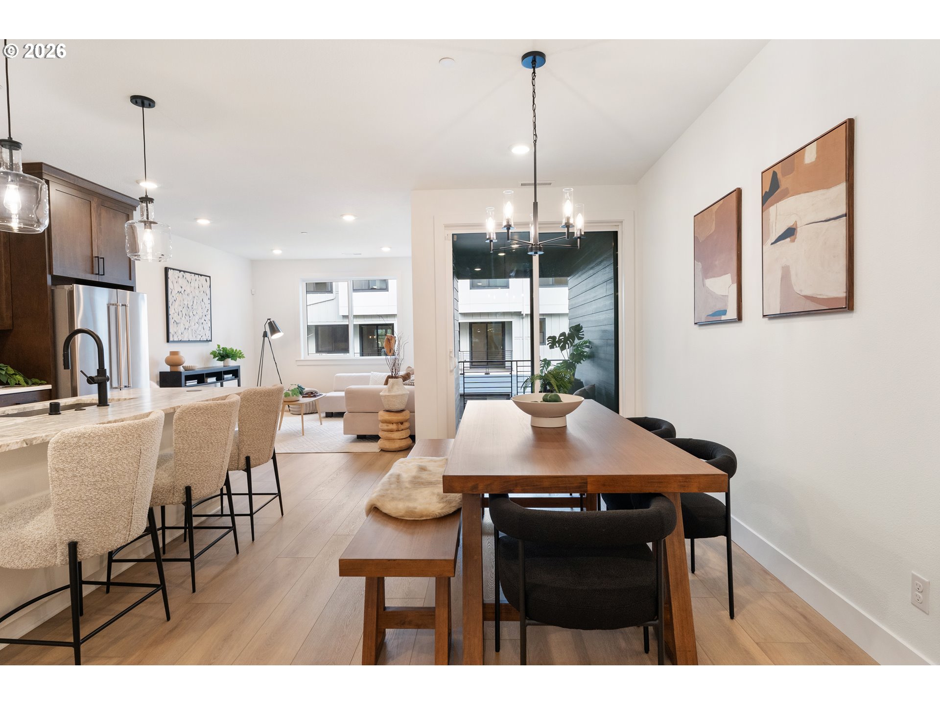 6487 Northwest Olympic Lane, Unit 27 Camas, WA 98607 - Photo 7 of 24 a view of a dining room with furniture window and wooden floor