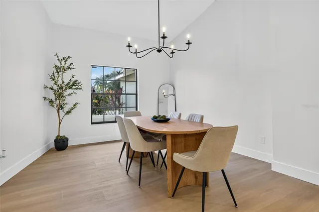 a view of a dining room with furniture and window