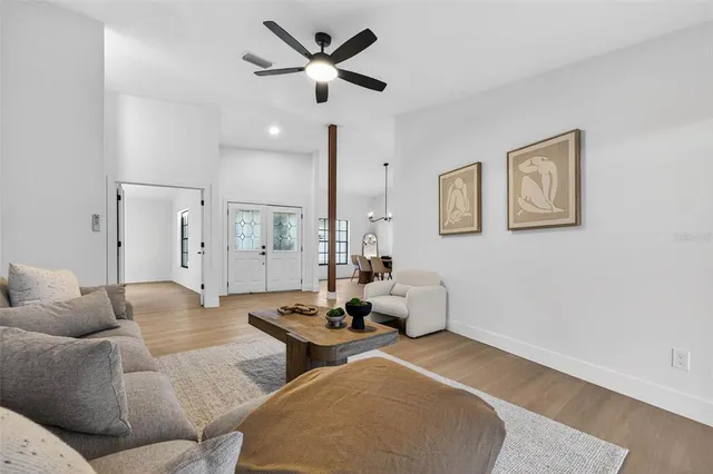 a living room with furniture and a large window