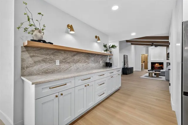 a view of living room with furniture and wooden floor