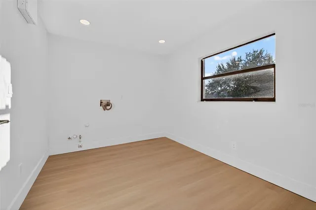 a view of a room with painting on the wall