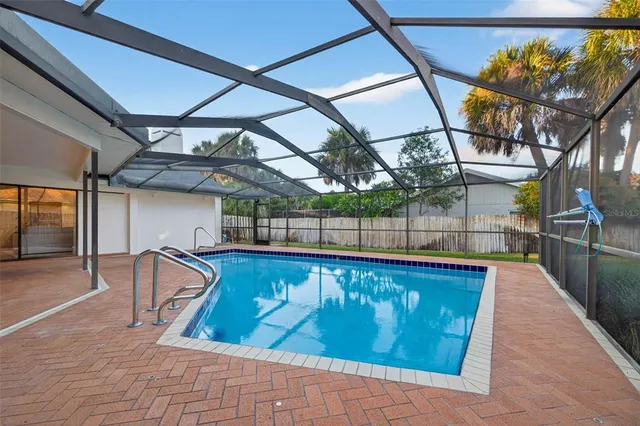 a view of swimming pool with seating area
