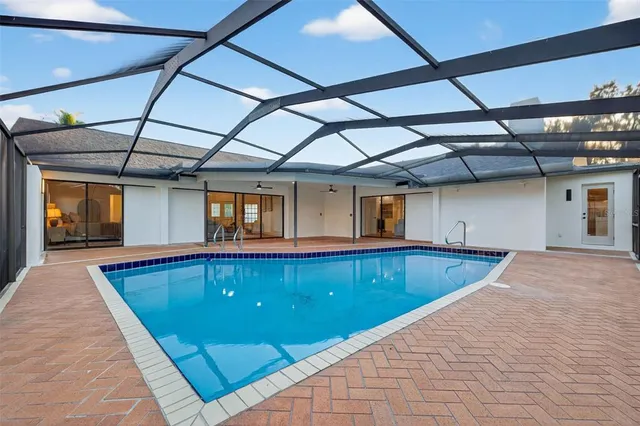 a view of swimming pool with seating area