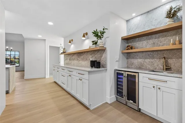 a kitchen with stainless steel appliances granite countertop a sink and cabinets