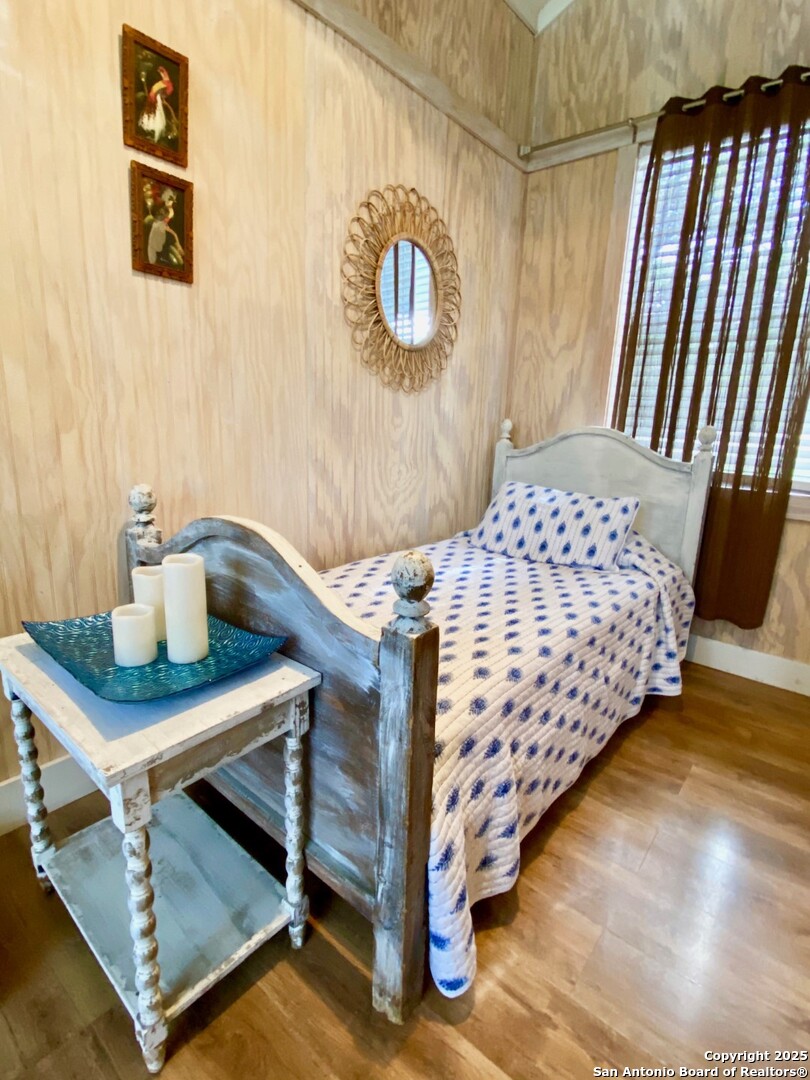 512 County Road 348 Concan, TX 78838 - Photo 23 of 39 a bedroom with a bed and a table