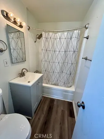 a bathroom with a bathtub and shower