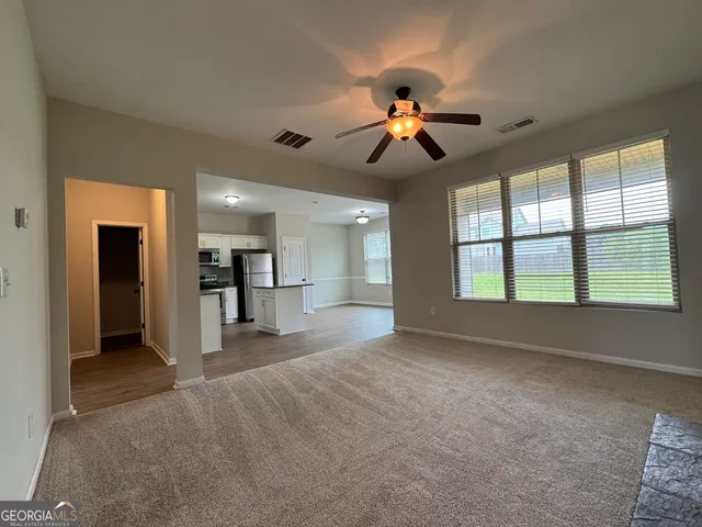 a view of a kitchen with a sink and a chandelier