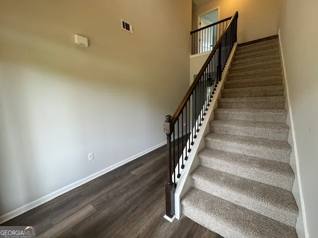 a view of a hallway with windows