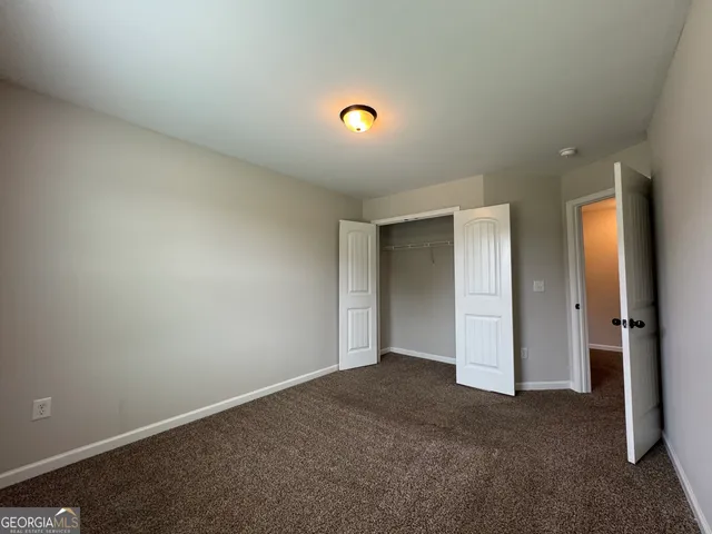 a bathroom with a toilet a sink and a mirror