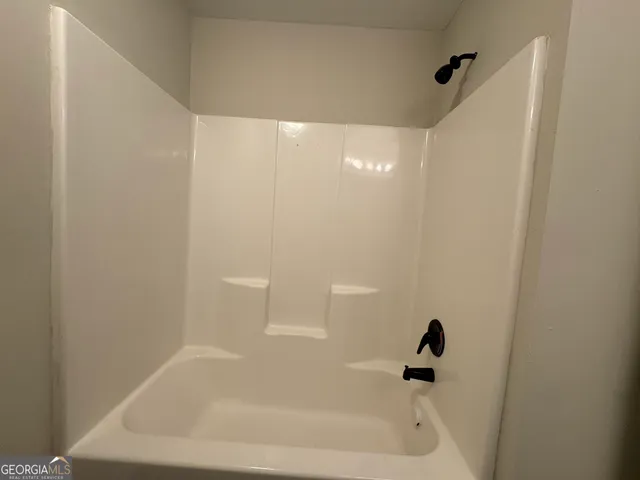 an aerial view of residential house with parking