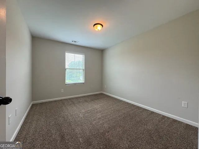 an aerial view of a house with swimming pool