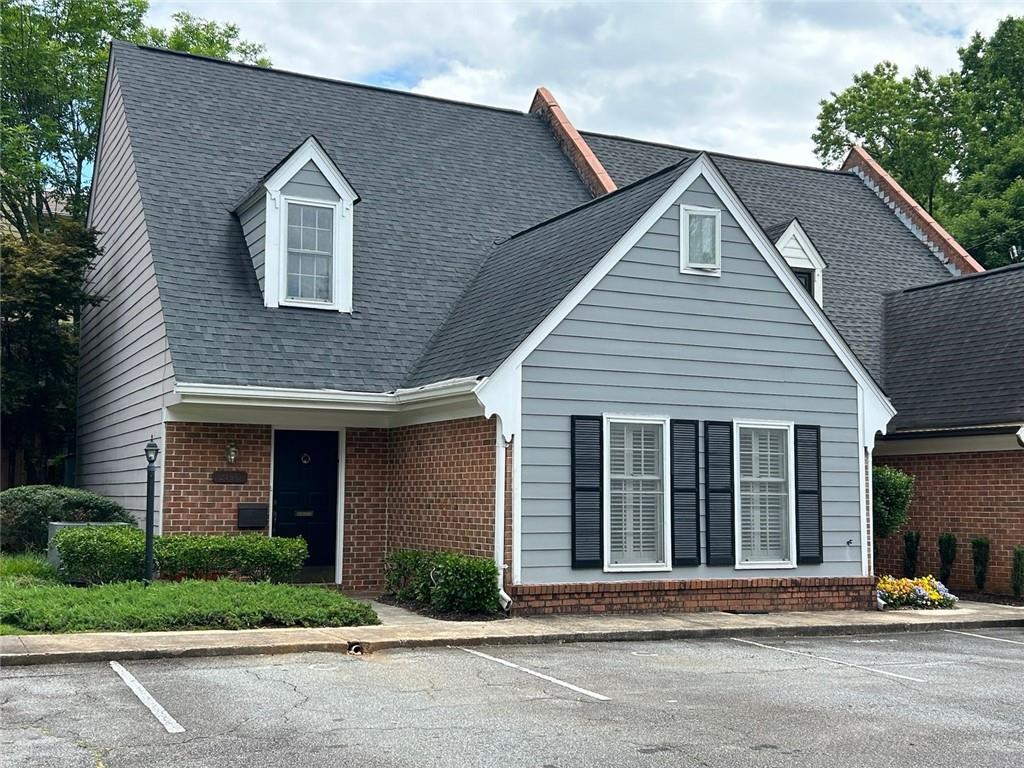 218 Forkner Drive, Unit C Decatur, GA 30030 - Photo 1 of 1 a front view of a house with a garden