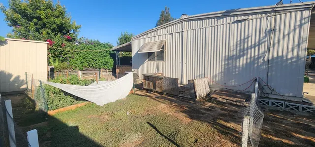 a view of a back yard of the house