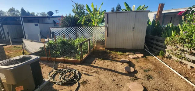 a view of a chairs and table in the patio
