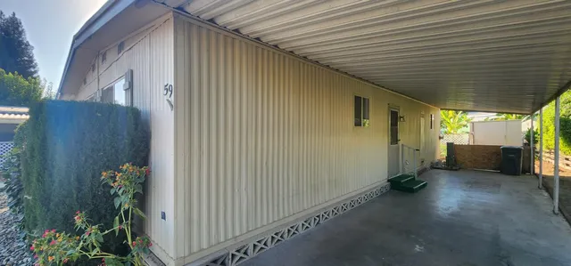 a view of a porch with wooden walls