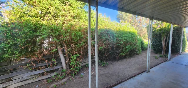 a view of a backyard with garden