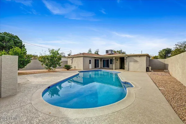 a house view with a swimming pool