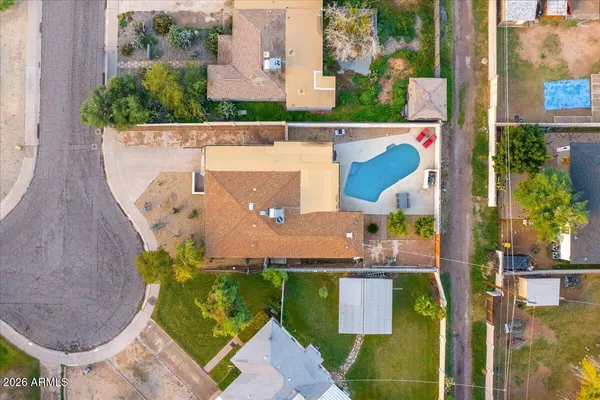 an aerial view of residential houses with outdoor space