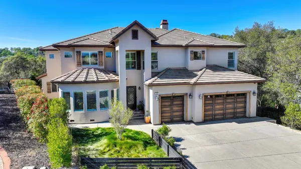a living room with furniture fireplace and a large window
