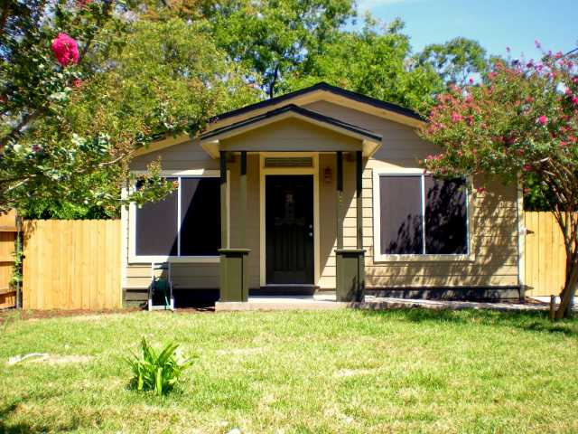 1107 Omega Avenue Austin, TX 78721 - Photo 1 of 1 a front view of a house with a yard