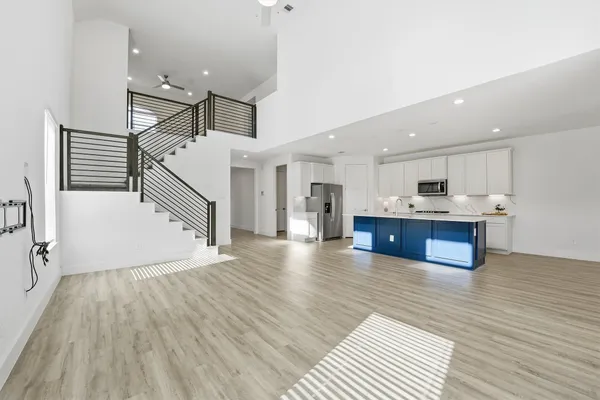a view of kitchen with cabinets and wooden floor