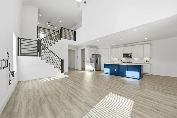 a view of kitchen with cabinets and wooden floor