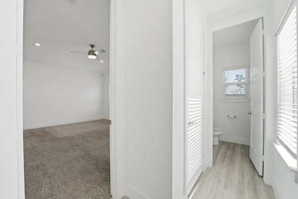 a view of a bathroom from the hallway