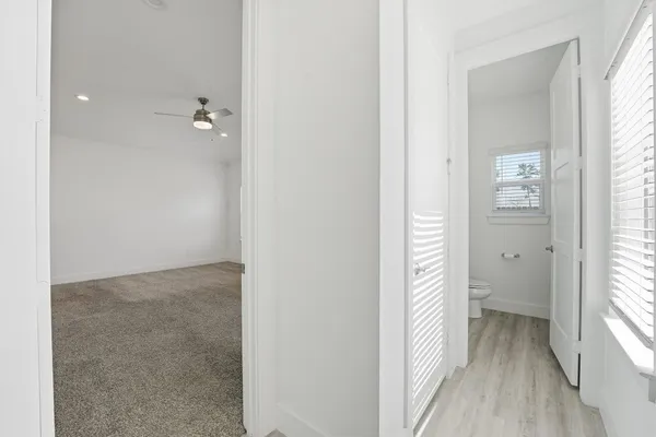 a view of a bathroom from the hallway