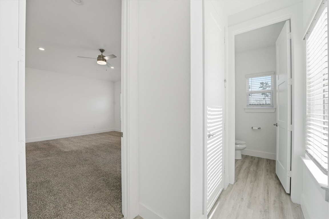 13744 Rising Sun Lane Conroe, TX 77384 - Photo 17 of 41 hallway leading to the primary bedroom