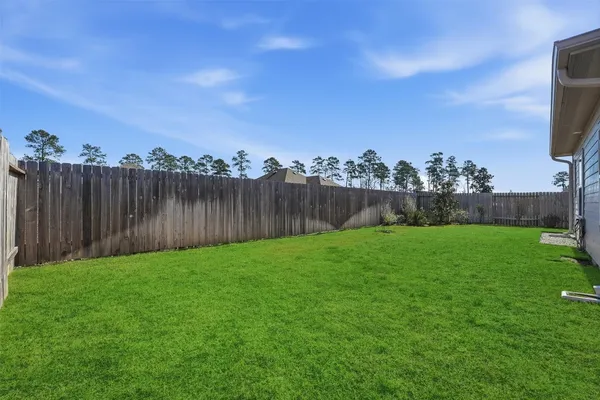 a view of a backyard with green space
