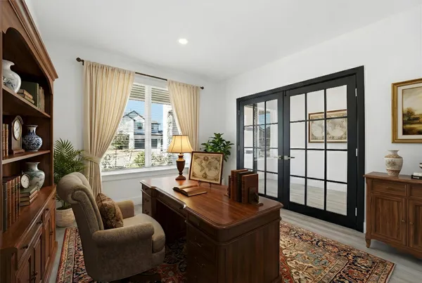 a living room with furniture and a floor to ceiling window
