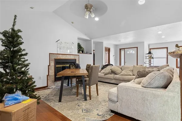 a living room with furniture and a fireplace