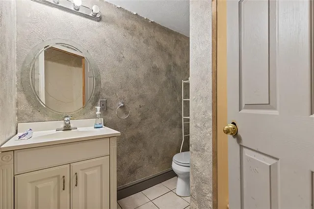 a view of a house with backyard sitting area and garden