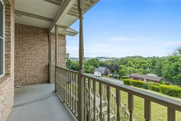 a view of a balcony with city view