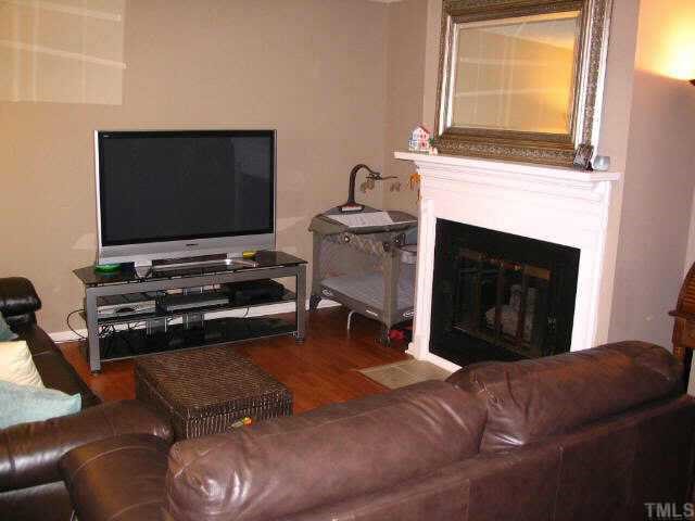 109 Rhum Place Garner, NC 27529 - Photo 2 of 9 LIVING RM/FIREPLACE W/CUSTOM MANTEL