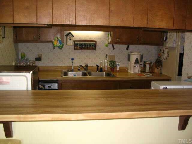 109 Rhum Place Garner, NC 27529 - Photo 4 of 9 KITCHEN/BREAKFAST BAR, REFRIGERATOR CONVEYS