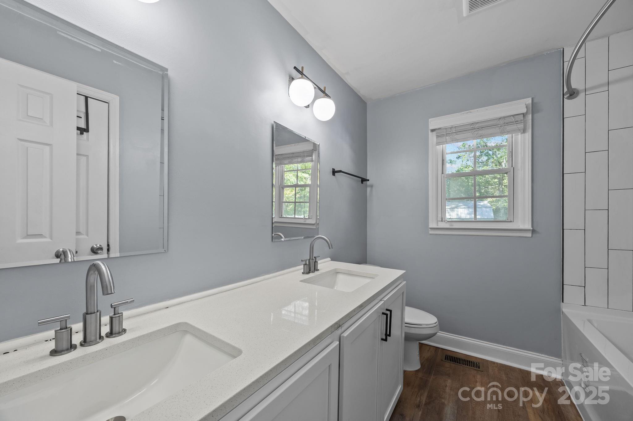 976 10 Oaks Drive Lancaster, SC 29720 - Photo 11 of 24 a bathroom with a sink a toilet and a mirror