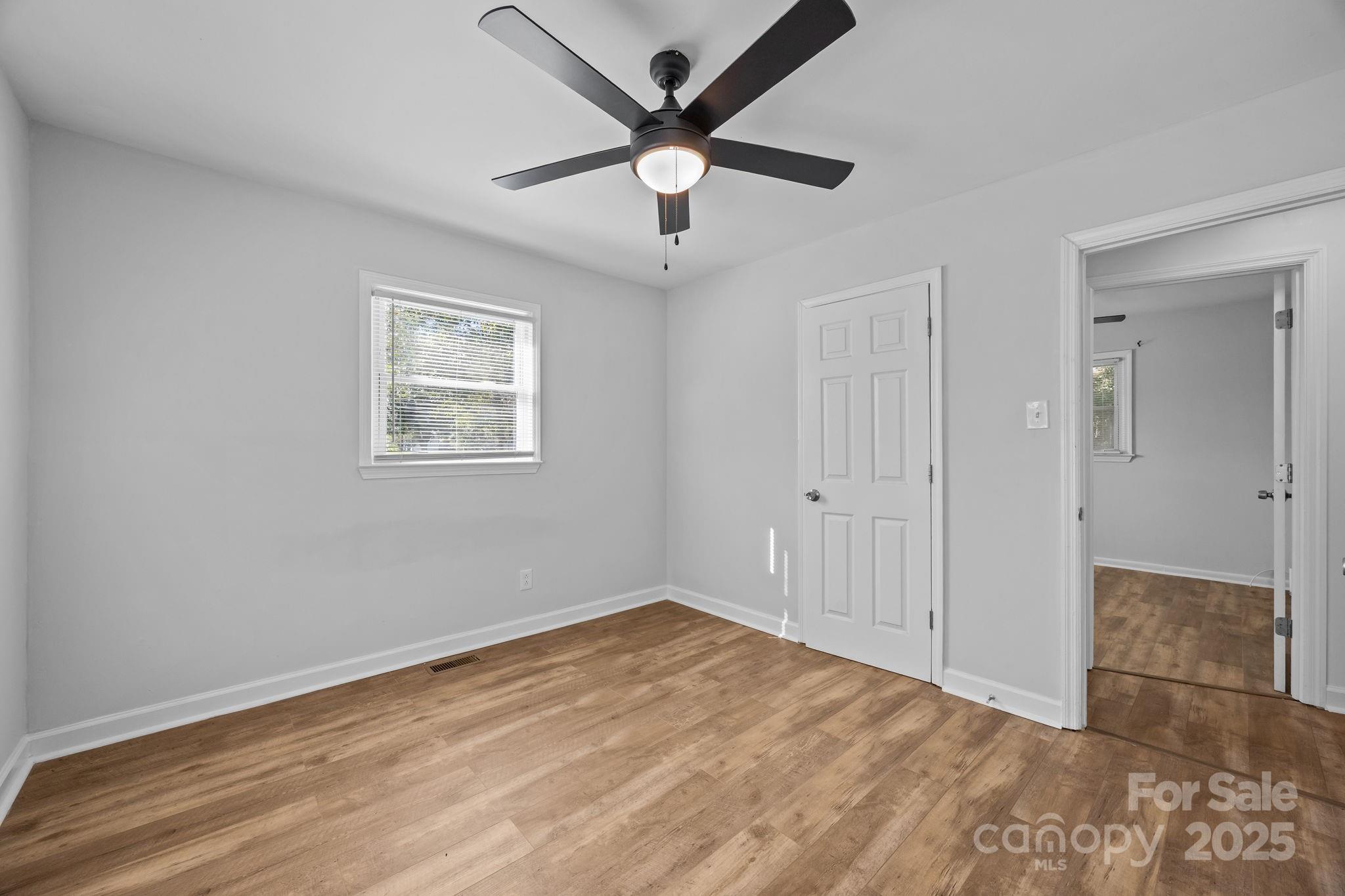 976 10 Oaks Drive Lancaster, SC 29720 - Photo 16 of 24 wooden floor in an empty room with a window