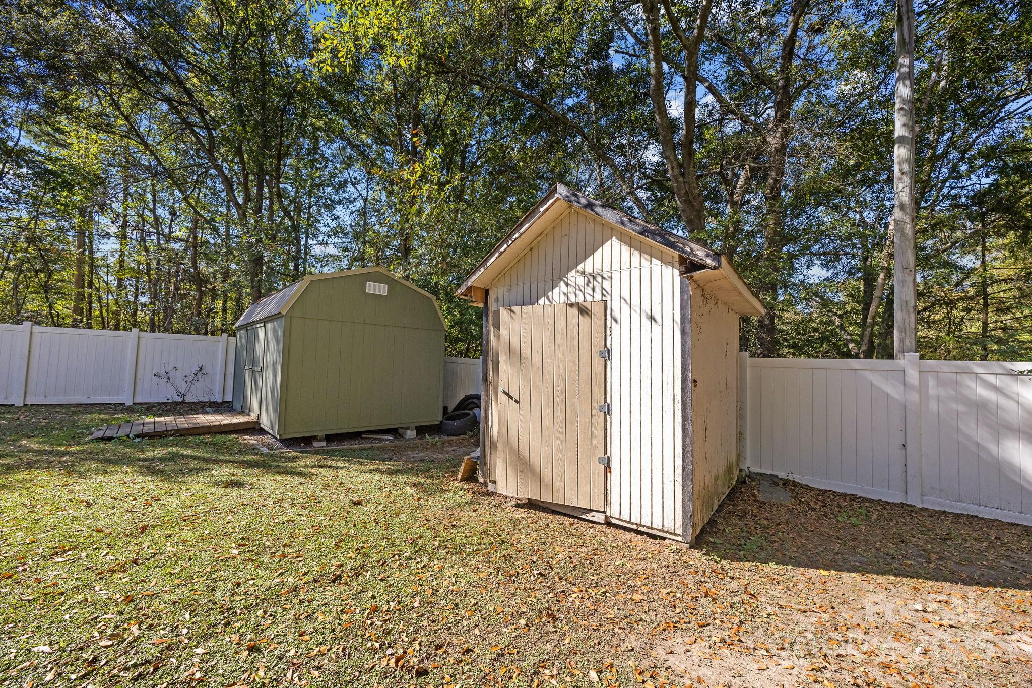 976 10 Oaks Drive Lancaster, SC 29720 - Photo 22 of 24 a view of backyard with wooden fence and large trees