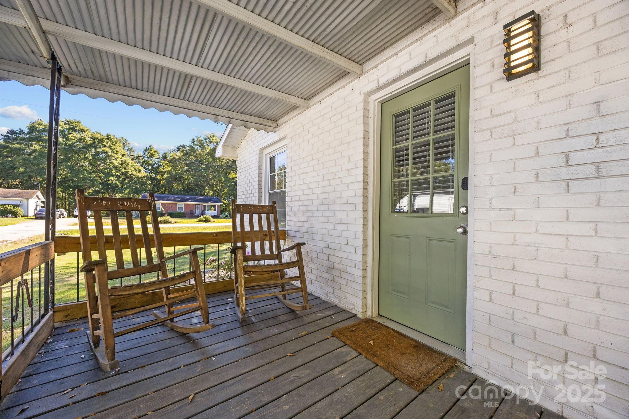 976 10 Oaks Drive Lancaster, SC 29720 - Photo 3 of 24 a view of a chairs on the deck