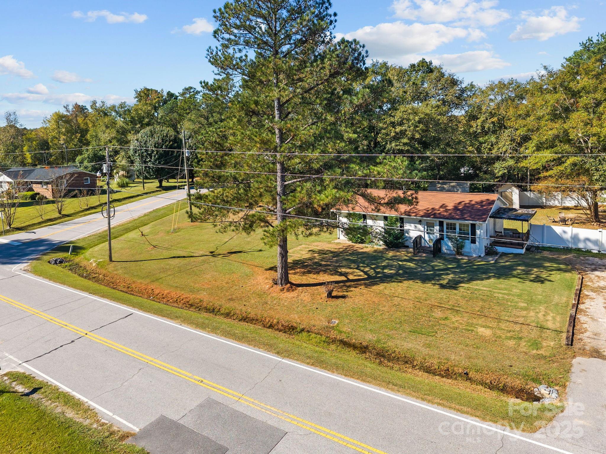 976 10 Oaks Drive Lancaster, SC 29720 - Photo 4 of 24 a view of a swimming pool with an outdoor seating